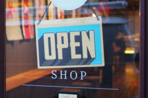 Open sign on storefront door