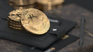 4 bitcoins on black wallet