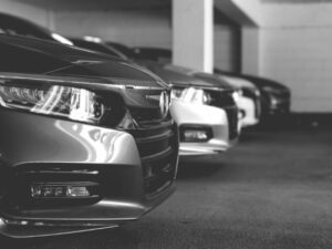 Fronts of cars parked in a parking garage.