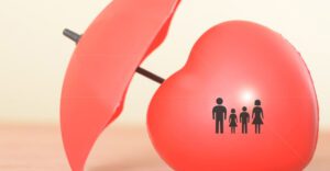 A red heart and umbrella featuring a family