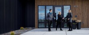 JCCS staff happily shake hands with a client