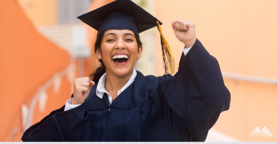 A woman excited to graduate from college