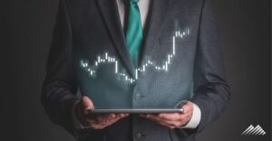 man holding tablet with stocks