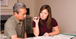 A couple goes over paperwork