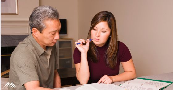 A couple goes over paperwork
