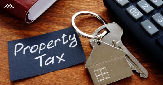 A set of house keys with a note that says Property Tax