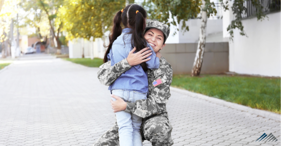 A soldier hugging her child