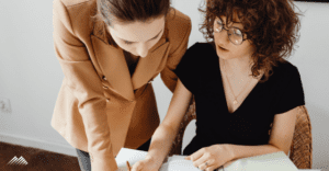 Two women going over paperwork