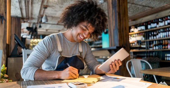 A business owner reconciling his books