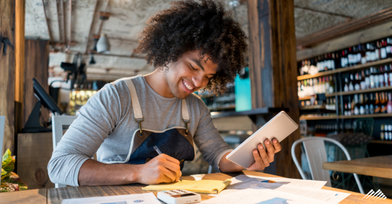 A business owner reconciling his books