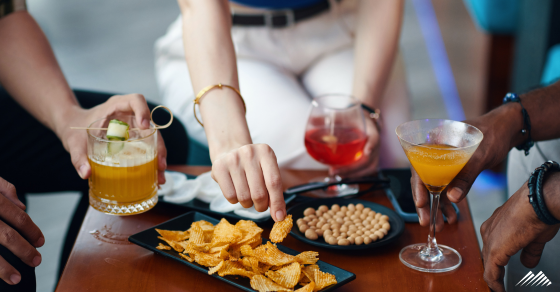 People with drinks and snacks