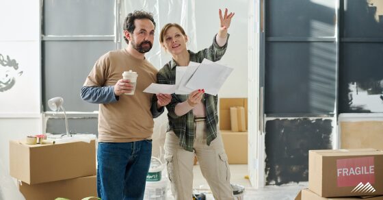 Two people renovating their home