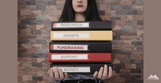 A woman carrying nonprofit books