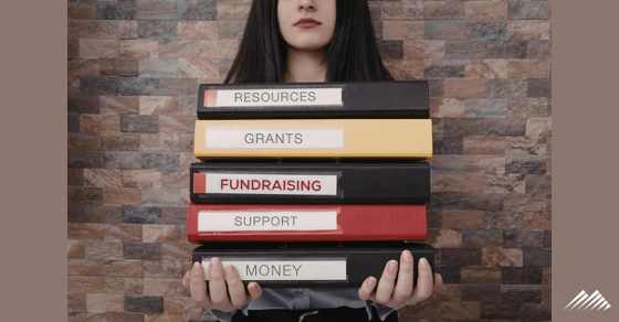 A woman carrying nonprofit books