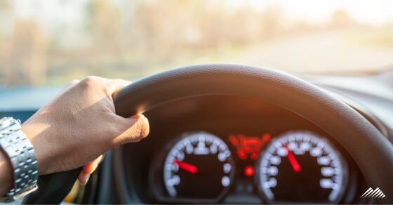Hand on steering wheel