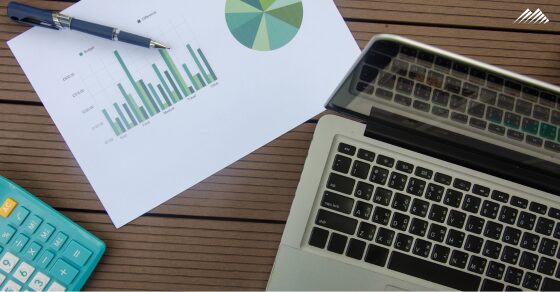 A calculator, computer, and financial sheet